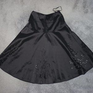 Black bell shirt with cutouts and beading